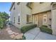 Charming home featuring a neatly landscaped front entrance, complemented by a stone walkway and manicured shrubbery at 11345 Espadrille Ct, Las Vegas, NV 89138