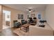 Inviting living room with a workspace, comfortable seating and lots of natural light at 11345 Espadrille Ct, Las Vegas, NV 89138