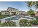 Expansive backyard featuring a gorgeous pool, spa, built-in grill, lush landscaping, and outdoor lounging at 11345 Espadrille Ct, Las Vegas, NV 89138