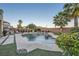 Inviting backyard pool and spa with stone accents, lush landscaping, and ample space for outdoor entertaining at 11345 Espadrille Ct, Las Vegas, NV 89138