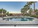 Beautiful backyard pool with a built-in spa and elegant landscaping features, perfect for outdoor relaxation at 11345 Espadrille Ct, Las Vegas, NV 89138