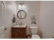 Stylish powder room features modern vanity with a round mirror and elegant decor at 11345 Espadrille Ct, Las Vegas, NV 89138