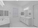 Bright bathroom features double sinks with white cabinets and marble-patterned tile floors at 11617 Peregrine Point Ct, Las Vegas, NV 89138