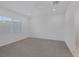 Spacious carpeted bedroom with natural lighting from a large window with blinds at 11617 Peregrine Point Ct, Las Vegas, NV 89138