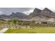 Community park featuring desert landscaping, a walking path, and mountain views at 11617 Peregrine Point Ct, Las Vegas, NV 89138
