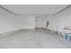 Clean garage with painted walls, high ceilings, and organized utility connections at 11617 Peregrine Point Ct, Las Vegas, NV 89138