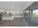Open-concept kitchen with island, stainless steel appliances, and sliding glass doors to backyard at 11617 Peregrine Point Ct, Las Vegas, NV 89138