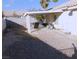 Spacious backyard with covered patio, privacy fence, and low-maintenance landscape at 1214 Emerald Stone Ave, North Las Vegas, NV 89081