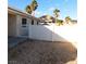 Fenced backyard providing privacy and security, complemented by desert landscaping at 1214 Emerald Stone Ave, North Las Vegas, NV 89081