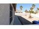 Spacious backyard with low maintenance landscaping, block wall, and mature trees at 1214 Emerald Stone Ave, North Las Vegas, NV 89081