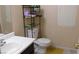 Cozy bathroom has a sink with mirror and toilet at 1214 Emerald Stone Ave, North Las Vegas, NV 89081
