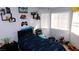 A cozy bedroom with neutral walls and decorative touches at 1214 Emerald Stone Ave, North Las Vegas, NV 89081