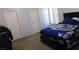 This bedroom features carpet and a large bed at 1214 Emerald Stone Ave, North Las Vegas, NV 89081