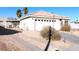 Charming single-story home with a well-maintained front yard and attached two-car garage at 1214 Emerald Stone Ave, North Las Vegas, NV 89081