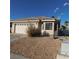 Charming home with a tile roof, attached two-car garage, and drought-tolerant landscaping at 1214 Emerald Stone Ave, North Las Vegas, NV 89081