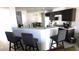 Kitchen area with bar seating and access to dining and appliances at 1214 Emerald Stone Ave, North Las Vegas, NV 89081