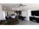 Open-concept living space with modern furnishings and a view to the kitchen at 1214 Emerald Stone Ave, North Las Vegas, NV 89081