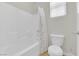 This bathroom features a bright white tiled shower-tub combination, with a window nearby at 1525 Spiced Wine Ave # 14105, Henderson, NV 89074