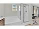 Bathroom featuring a tiled shower with glass enclosure and soaking tub at 1525 Spiced Wine Ave # 14105, Henderson, NV 89074