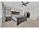Comfortable bedroom featuring a large bed, ceiling fan, and walk-in closet at 1525 Spiced Wine Ave # 14105, Henderson, NV 89074