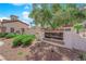 Welcoming entrance sign for the 'La Tesoro' community, beautifully landscaped with greenery at 1525 Spiced Wine Ave # 14105, Henderson, NV 89074