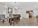 Bright dining room with stylish lighting, table, and easy access to kitchen at 1525 Spiced Wine Ave # 14105, Henderson, NV 89074
