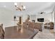 Open-concept living space with dining area, modern lighting, and living room view at 1525 Spiced Wine Ave # 14105, Henderson, NV 89074