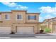 Inviting multi-story townhome featuring a two-car garage and neutral color palette at 1525 Spiced Wine Ave # 14105, Henderson, NV 89074