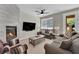 Bright living room featuring a sleek fireplace and stylish furnishings at 1525 Spiced Wine Ave # 14105, Henderson, NV 89074