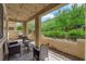 Cozy covered patio with seating area and views of landscaped backyard at 1525 Spiced Wine Ave # 14105, Henderson, NV 89074