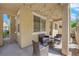 Relaxing covered patio with stylish furniture and string lights at 1525 Spiced Wine Ave # 14105, Henderson, NV 89074
