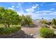 Expansive backyard featuring desert landscaping and decorative stone features at 1613 Williamsport St, Henderson, NV 89052