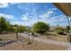 Landscaped backyard with desert landscaping and a stone walkway at 1613 Williamsport St, Henderson, NV 89052