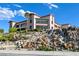 Exterior of a building with a waterfall and lush landscaping at 1613 Williamsport St, Henderson, NV 89052