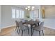 Bright dining room featuring modern chandelier, window shutters, and neutral decor at 1613 Williamsport St, Henderson, NV 89052