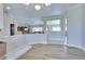 Open floorplan featuring crown molding and light wood-look flooring at 1613 Williamsport St, Henderson, NV 89052