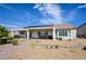 Home with solar panels features low-maintenance landscaping and covered patio at 1613 Williamsport St, Henderson, NV 89052