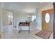 Inviting foyer with tile flooring, decorative front door, and charming decor at 1613 Williamsport St, Henderson, NV 89052