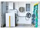 Garage with Tesla Powerwall and electric vehicle charger, as well as a step ladder at 1613 Williamsport St, Henderson, NV 89052