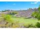 View of the golf course with lush green fairway and nearby hillside homes at 1613 Williamsport St, Henderson, NV 89052
