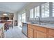 Kitchen boasts ample counter space, stainless steel appliances, and natural light from the sliding doors at 1613 Williamsport St, Henderson, NV 89052