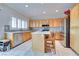 Kitchen featuring stainless steel appliances, stone backsplash, white countertops, and a center island at 1613 Williamsport St, Henderson, NV 89052