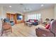 Spacious living room featuring hardwood floors, bright windows, and comfortable seating at 1613 Williamsport St, Henderson, NV 89052