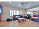 Open-concept living room boasts hardwood floors, shutters, and comfortable seating at 1613 Williamsport St, Henderson, NV 89052