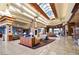 Grand lobby with high ceilings, skylights, elegant seating, and a welcoming atmosphere for residents and visitors at 1613 Williamsport St, Henderson, NV 89052