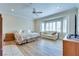 A spacious main bedroom featuring wood floors, bay windows with plantation shutters, and a cozy seating area at 1613 Williamsport St, Henderson, NV 89052