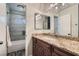 Bathroom featuring granite countertop, mirror and tile flooring at 1672 Cloister Ave, Henderson, NV 89014
