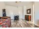 Bedroom featuring hardwood floors and neutral walls with modern decorative elements at 1672 Cloister Ave, Henderson, NV 89014
