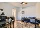 Well-lit bedroom featuring neutral walls and an office setup at 1672 Cloister Ave, Henderson, NV 89014