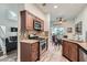 Well-lit kitchen featuring stainless steel appliances, granite countertops, and a decorative tile backsplash at 1672 Cloister Ave, Henderson, NV 89014